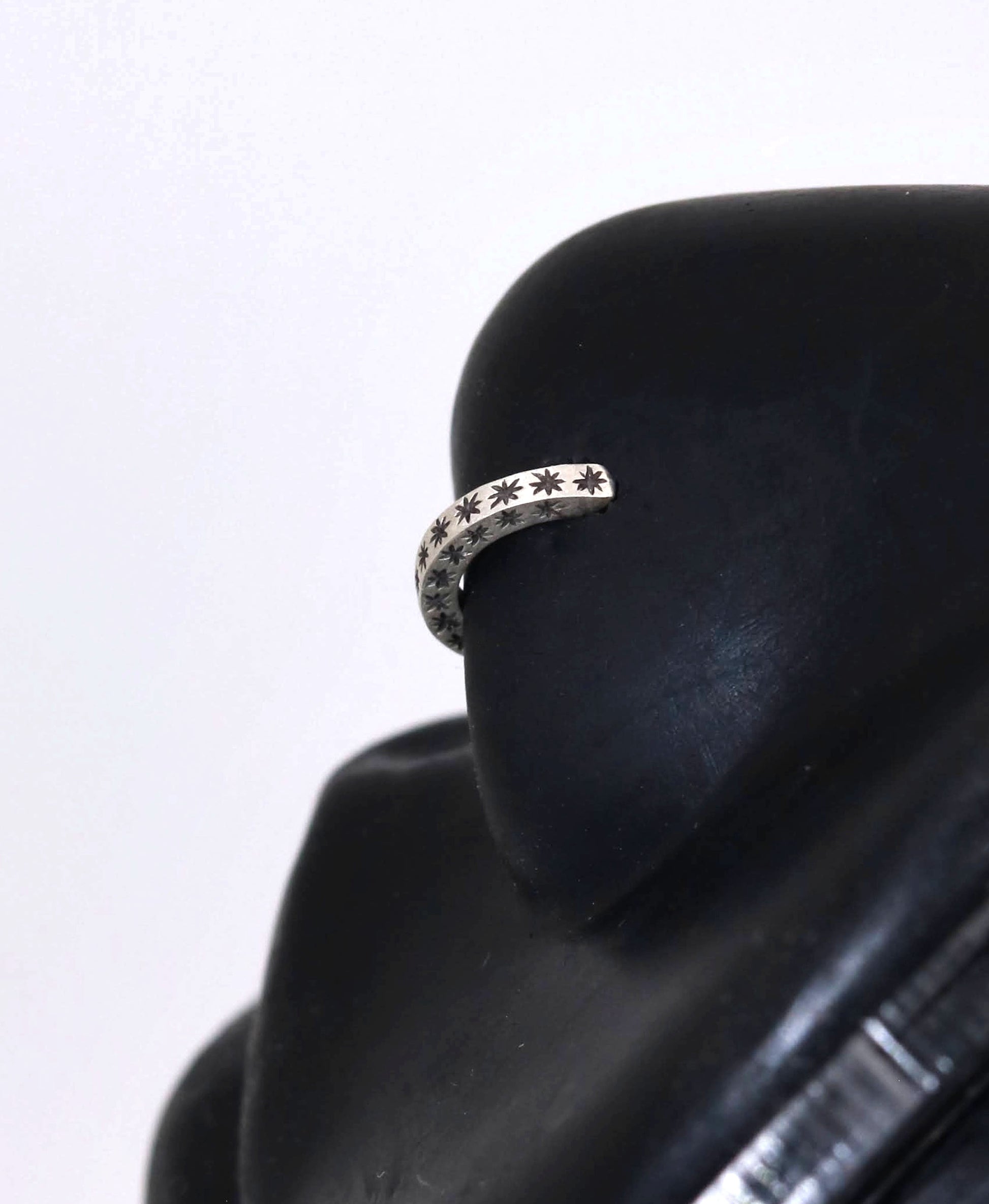 14k gold or sterling silver nose huggie hoop stud illusion hoop nostril jewelry with hand carved stars. Completely handmade by a small business.