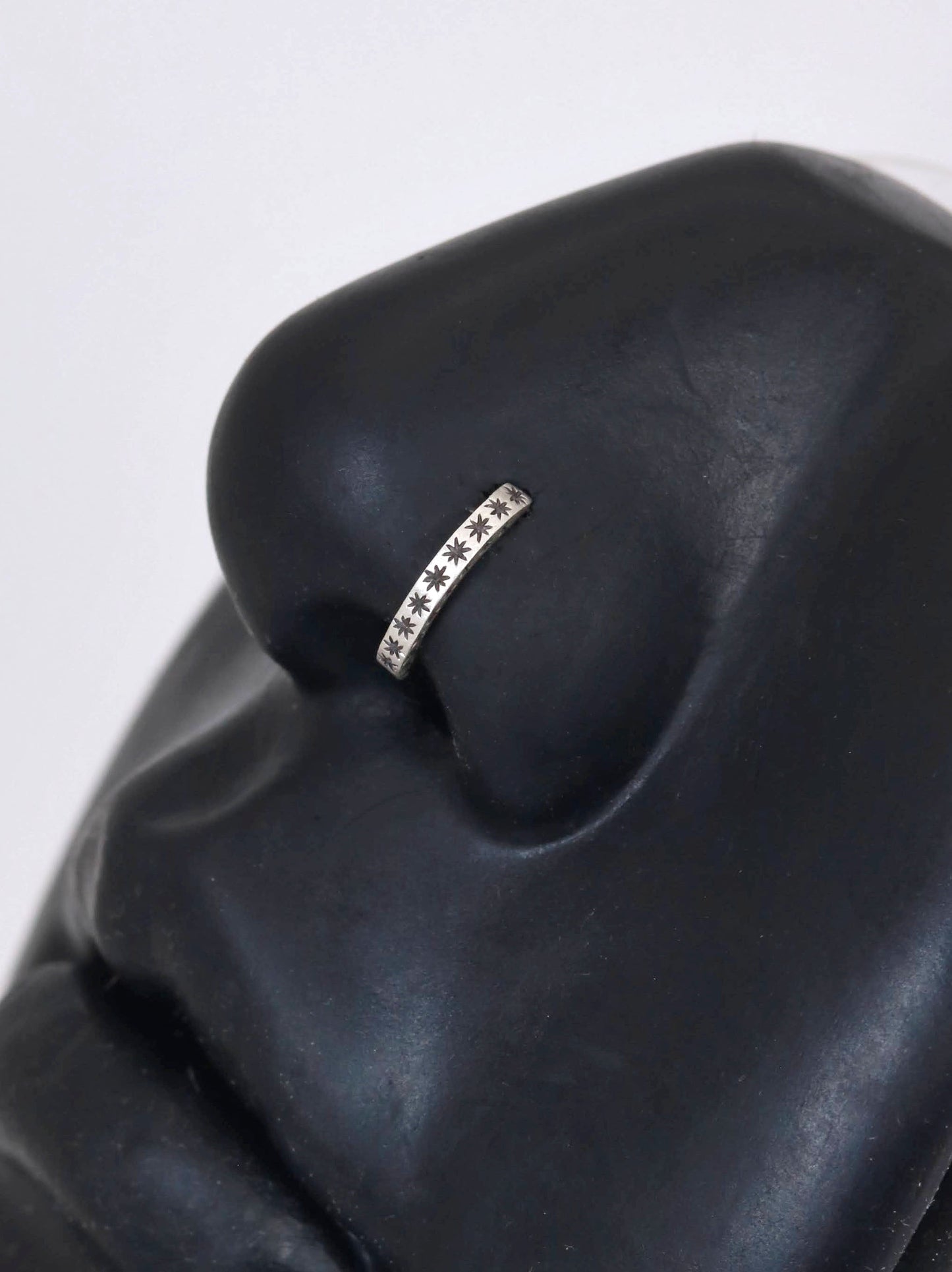 14k gold or sterling silver nose huggie hoop stud illusion hoop nostril jewelry with hand carved stars. Completely handmade by a small business.