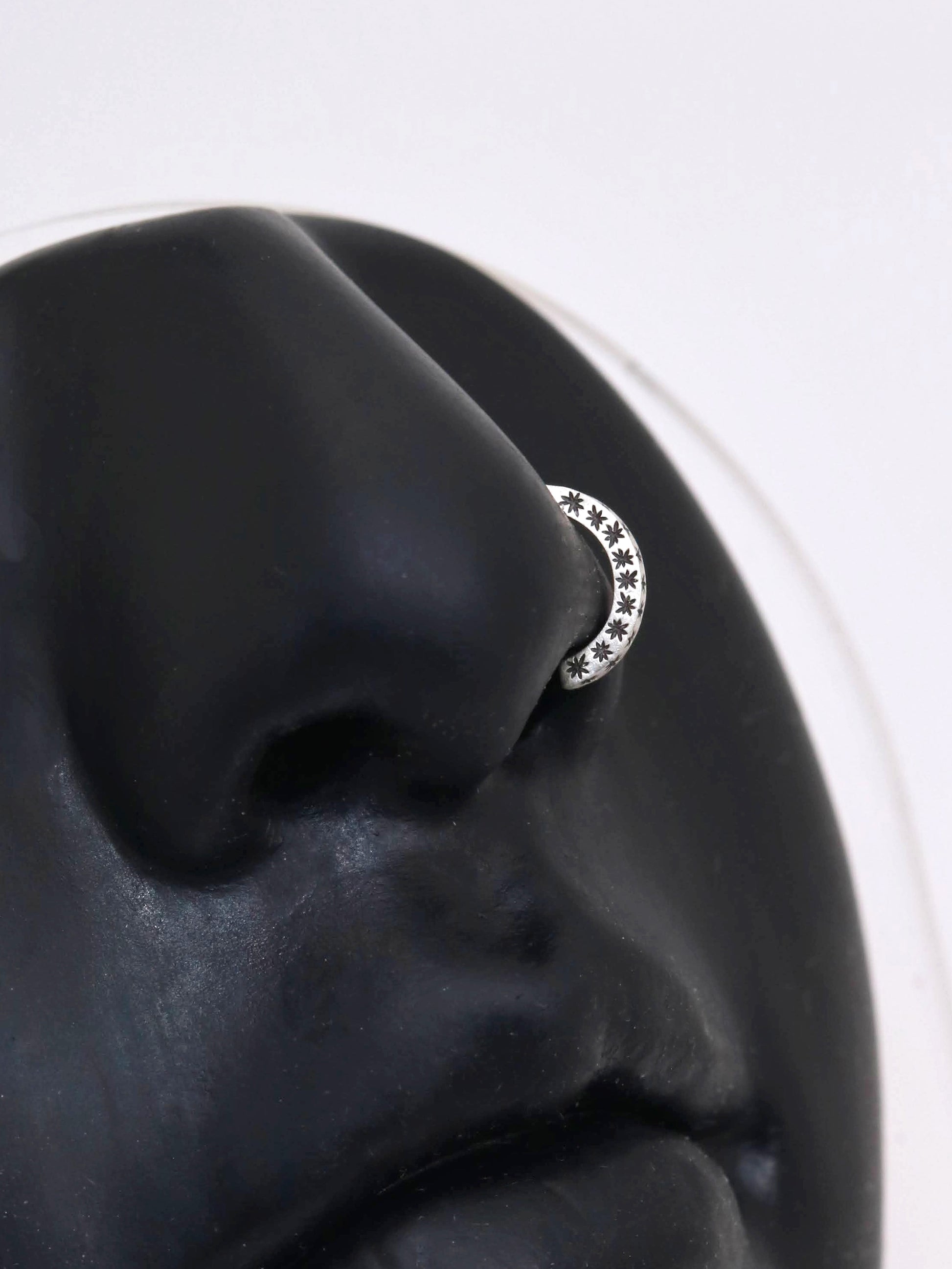 14k gold or sterling silver nose huggie hoop stud illusion hoop nostril jewelry with hand carved stars. Completely handmade by a small business.