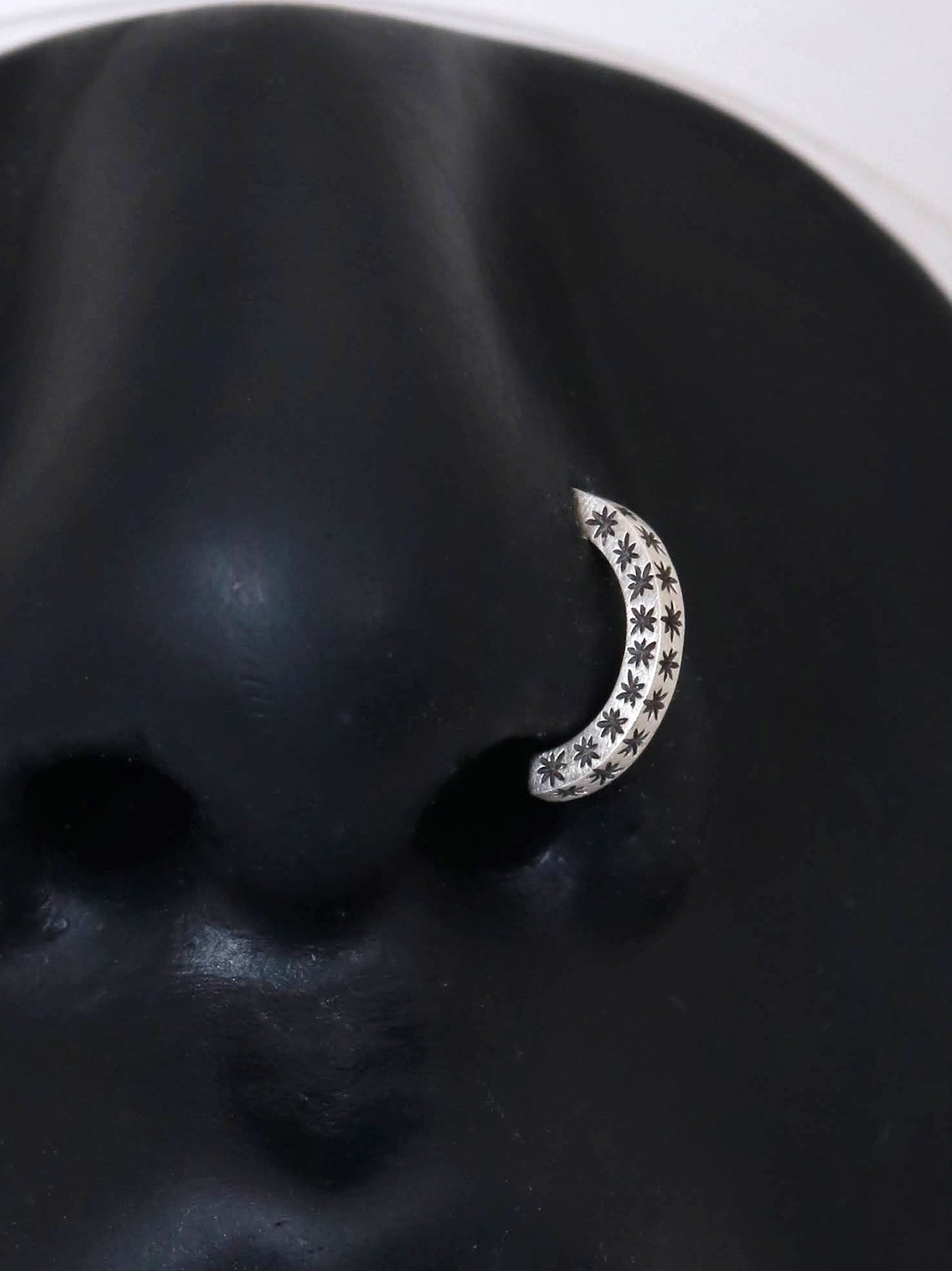 14k gold or sterling silver nose huggie hoop stud illusion hoop nostril jewelry with hand carved stars. Completely handmade by a small business.
