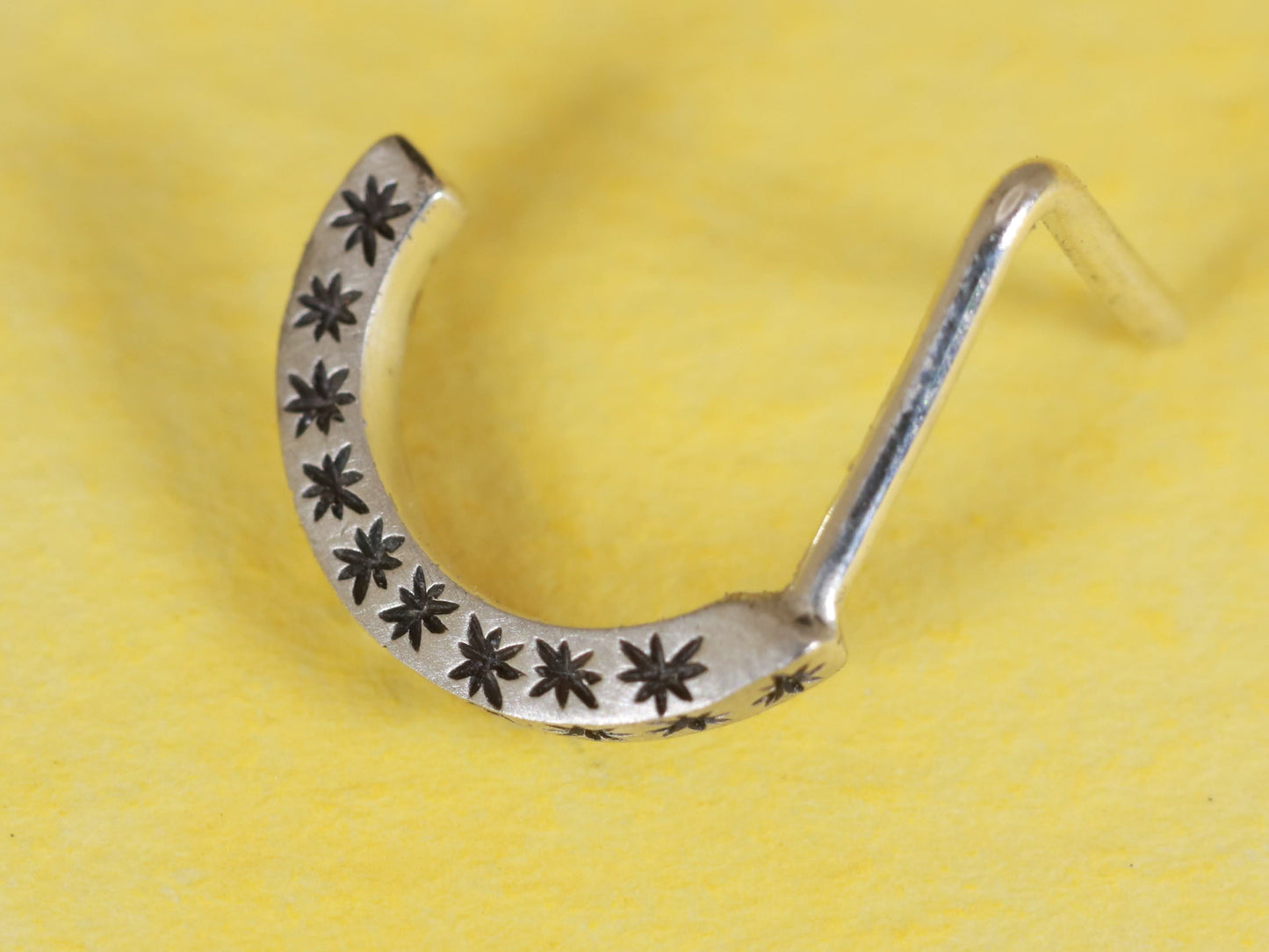 14k gold or sterling silver nose huggie hoop stud illusion hoop nostril jewelry with hand carved stars. Completely handmade by a small business.