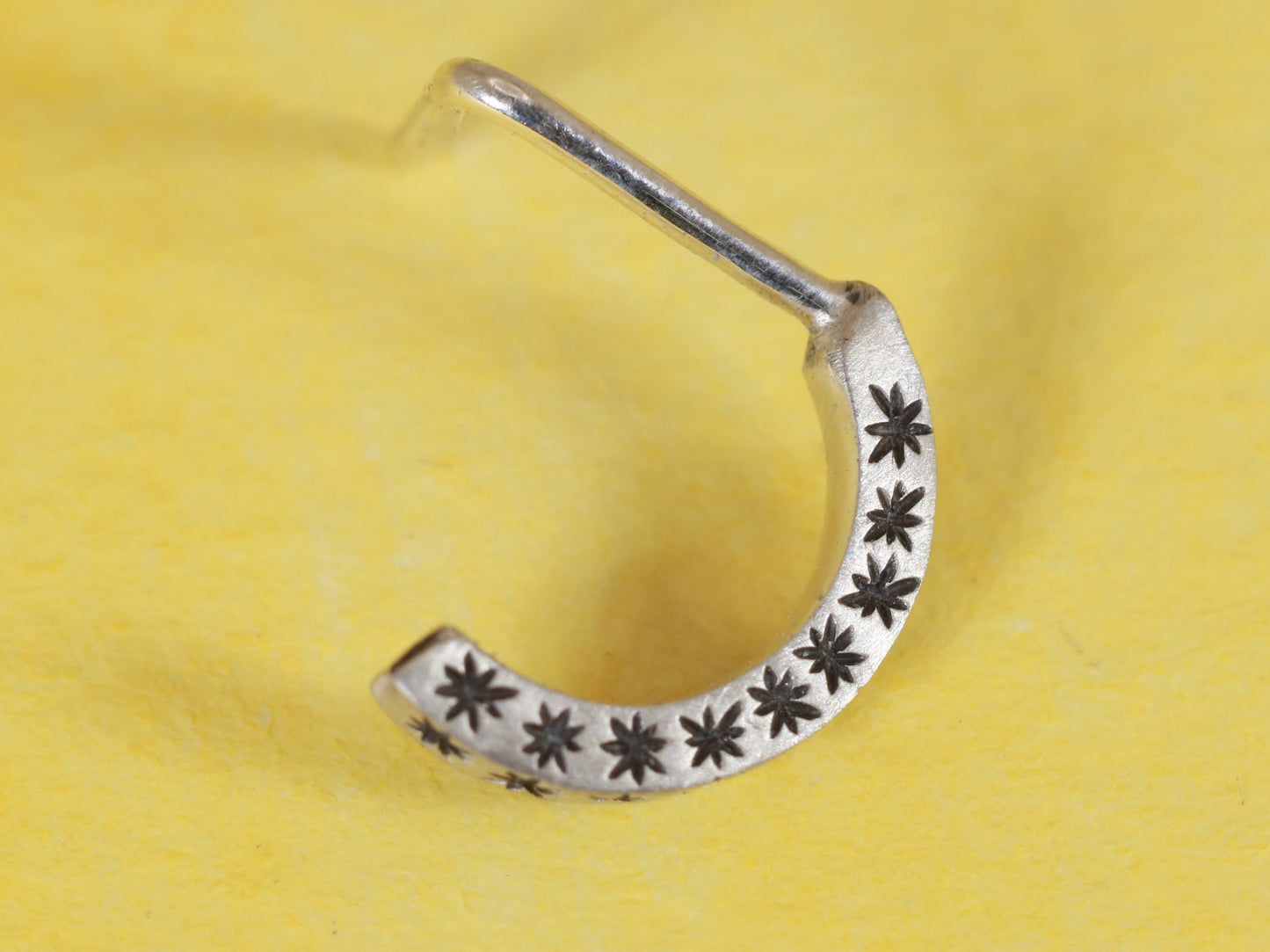 14k gold or sterling silver nose huggie hoop stud illusion hoop nostril jewelry with hand carved stars. Completely handmade by a small business.