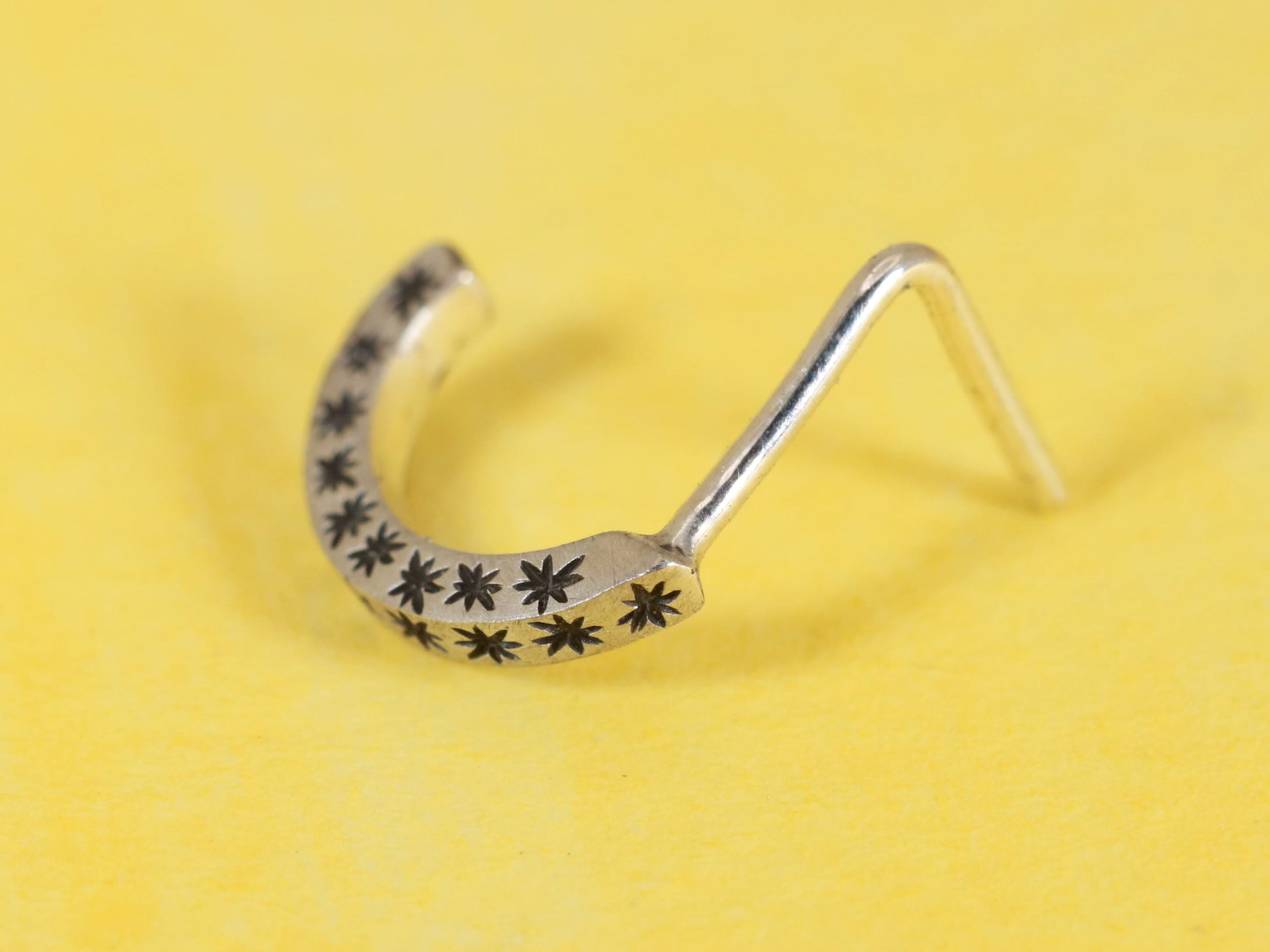 14k gold or sterling silver nose huggie hoop stud illusion hoop nostril jewelry with hand carved stars. Completely handmade by a small business.
