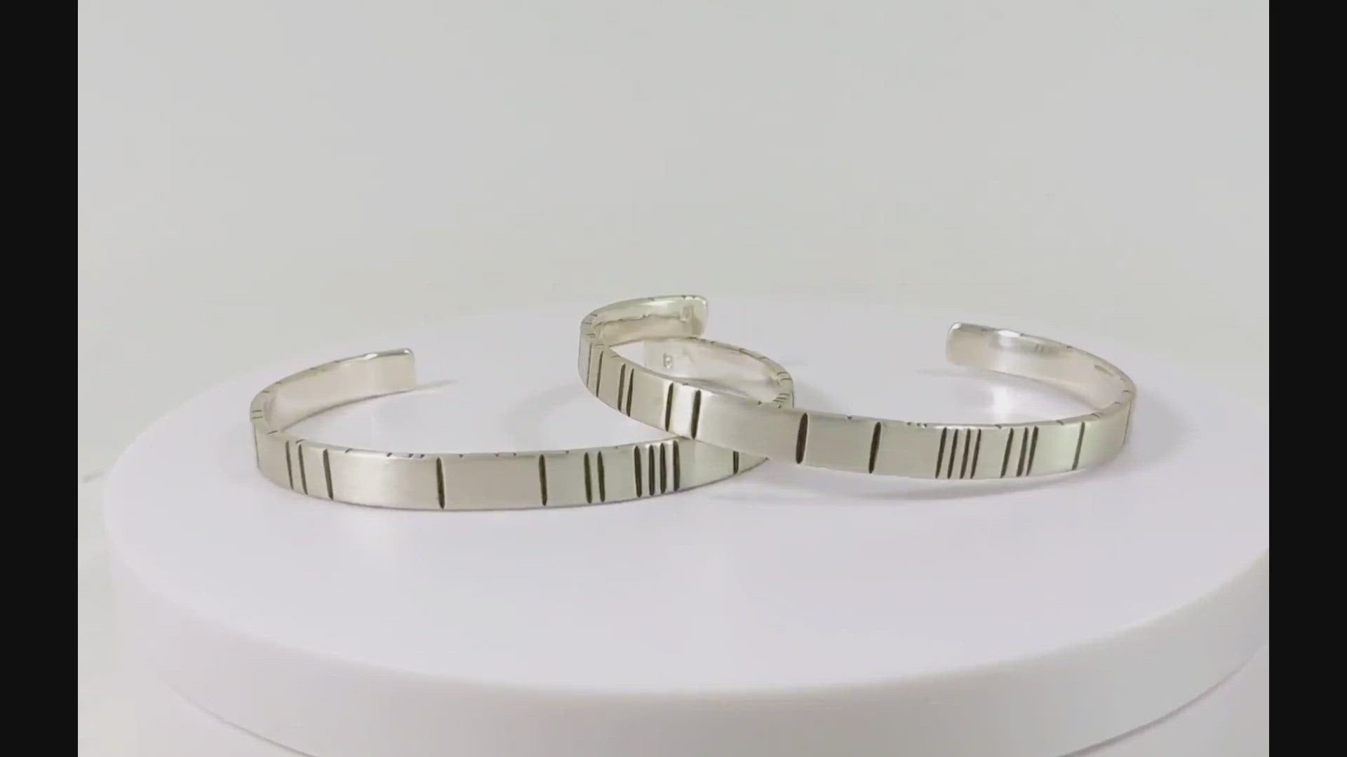 6mm sterling silver cuff with randomly spaced black lines.
