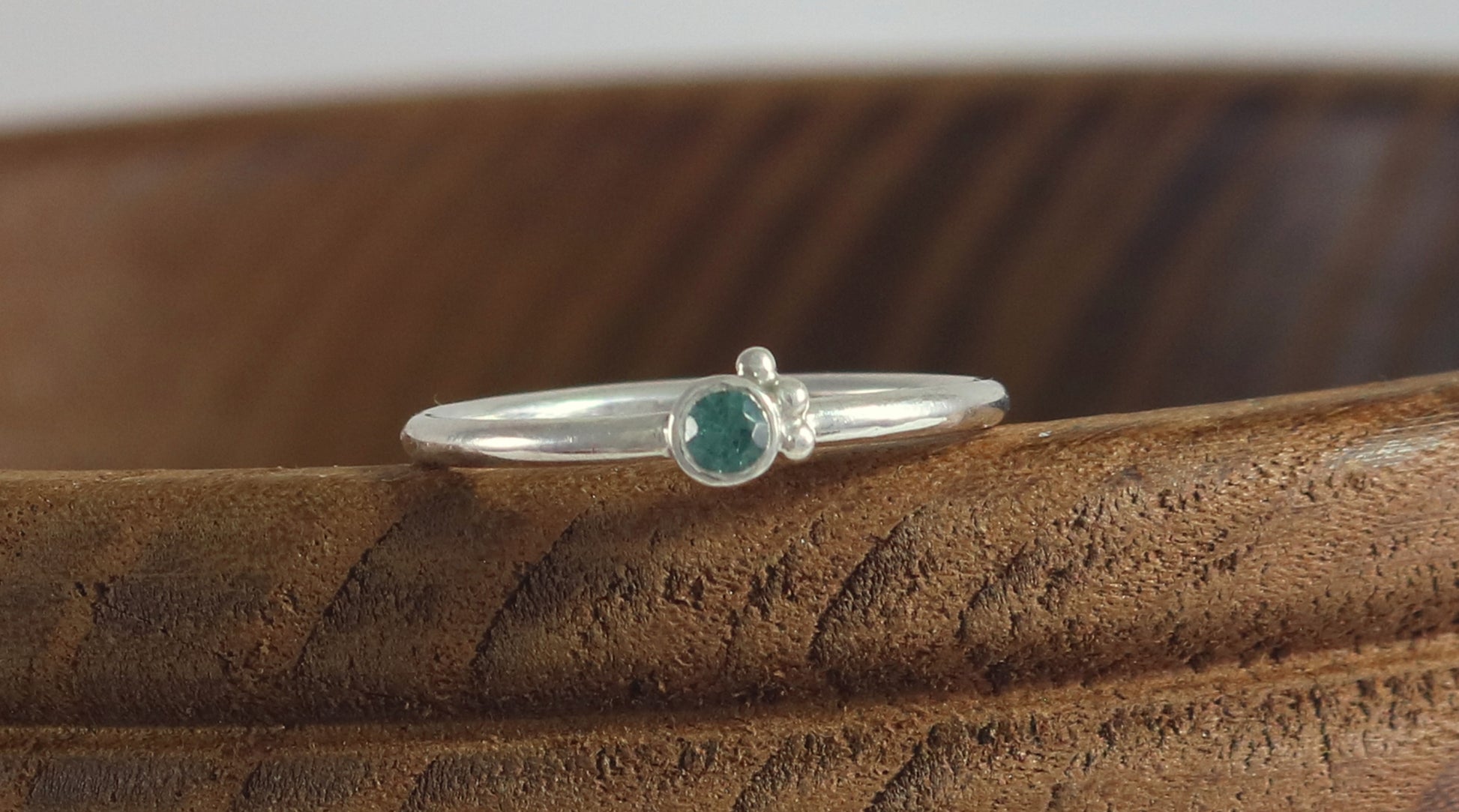 Natural gemstone set in sterling silver bezel, 3 silver bubble accents along bezel on sterling silver ring band.