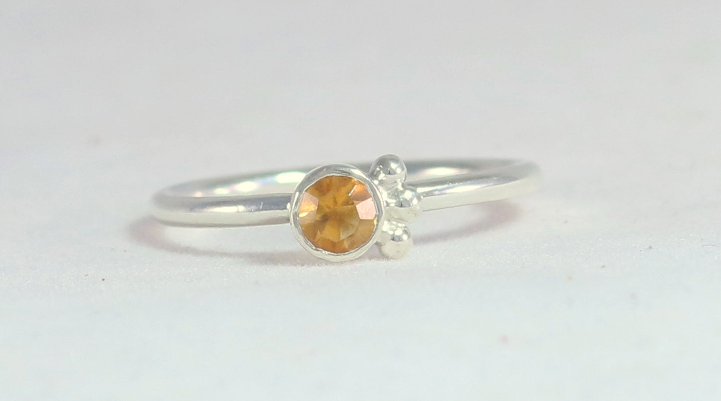 Natural gemstone set in sterling silver bezel, 3 silver bubble accents along bezel on sterling silver ring band.