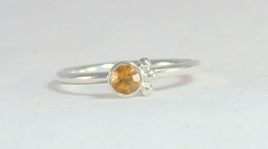 Natural gemstone set in sterling silver bezel, 3 silver bubble accents along bezel on sterling silver ring band.