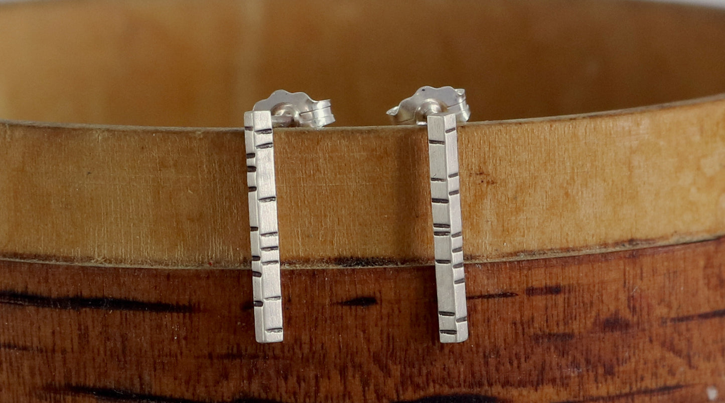 1.5mm thick solid sterling silver, rectangle bar studs with randomly spaced black lines.