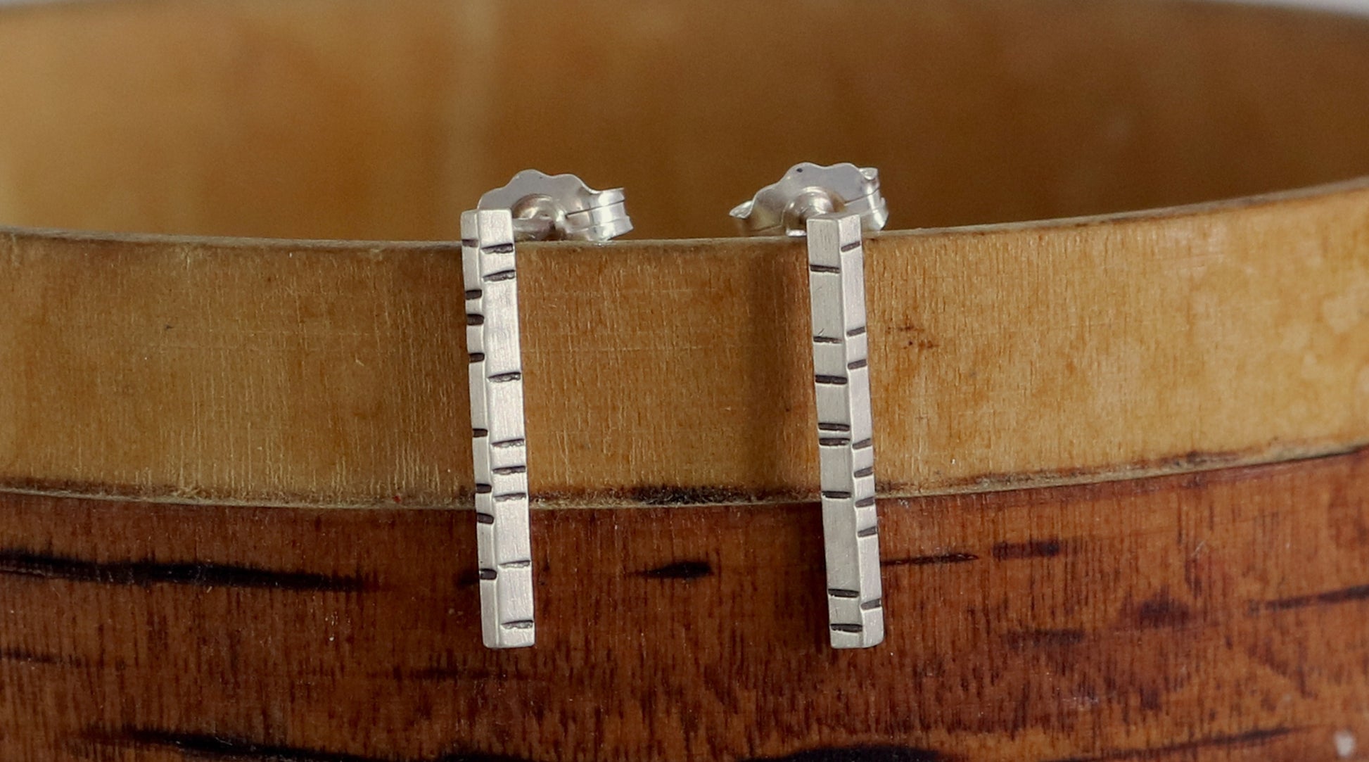 1.5mm thick solid sterling silver, rectangle bar studs with randomly spaced black lines.