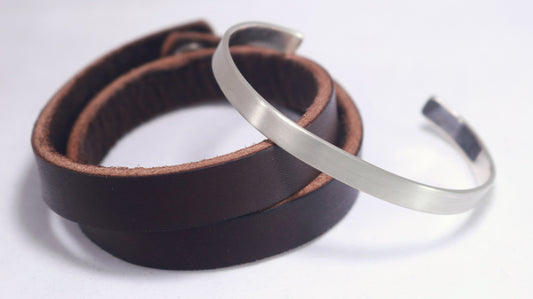 A 6mm sterling silver cuff with a matte finish outside & polished inside.