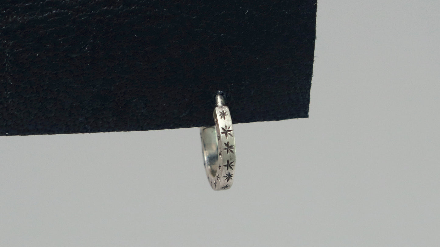 Hoops made from 1.5mm x 1.5mm square sterling silver, hand cut black stars on all outward facing sides.