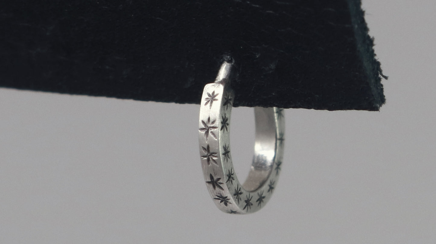 Hoops made from 1.5mm x 1.5mm square sterling silver, hand cut black stars on all outward facing sides.