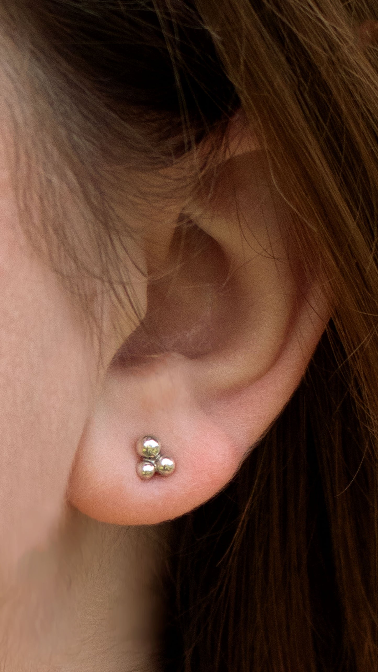 Stud earrings with three sterling silver bubbles in a pyramid.