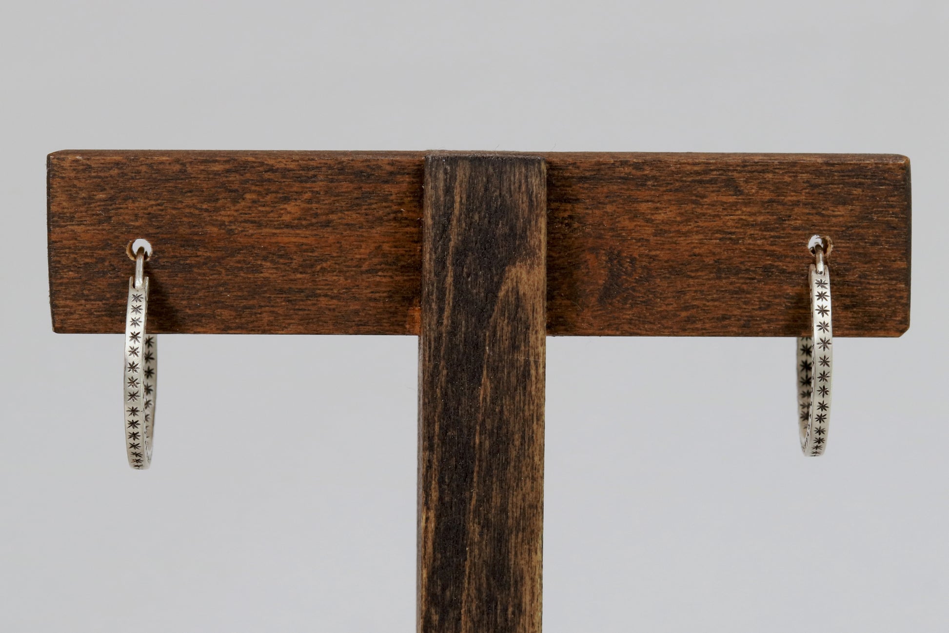 Closing hoops made from 2mm x 2mm square sterling silver, hand cut black stars on all sides.