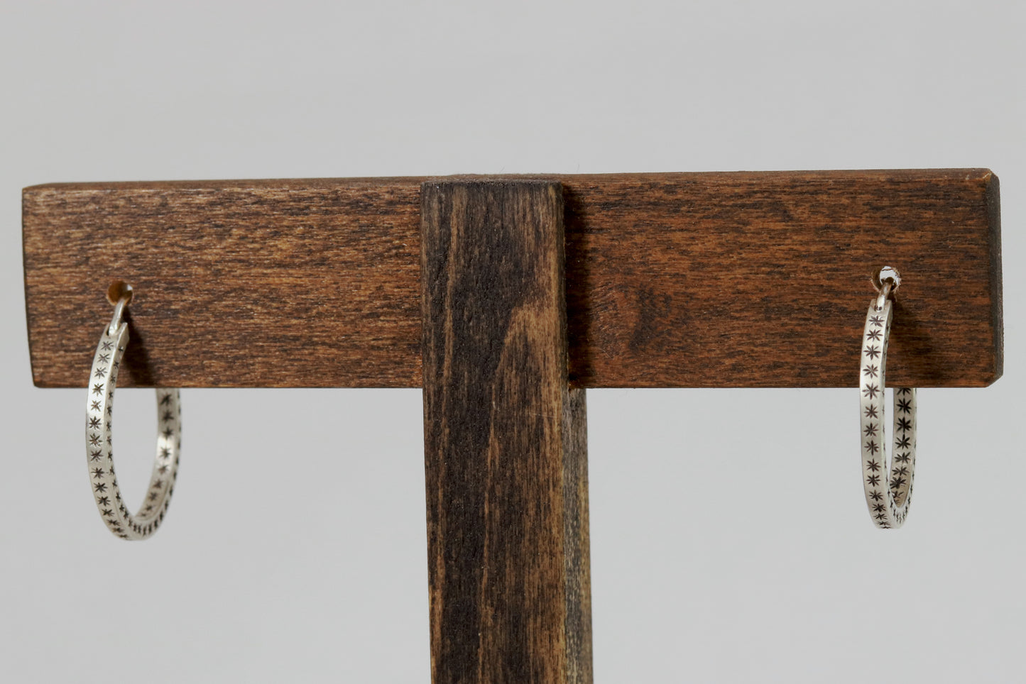 Closing hoops made from 2mm x 2mm square sterling silver, hand cut black stars on all sides.