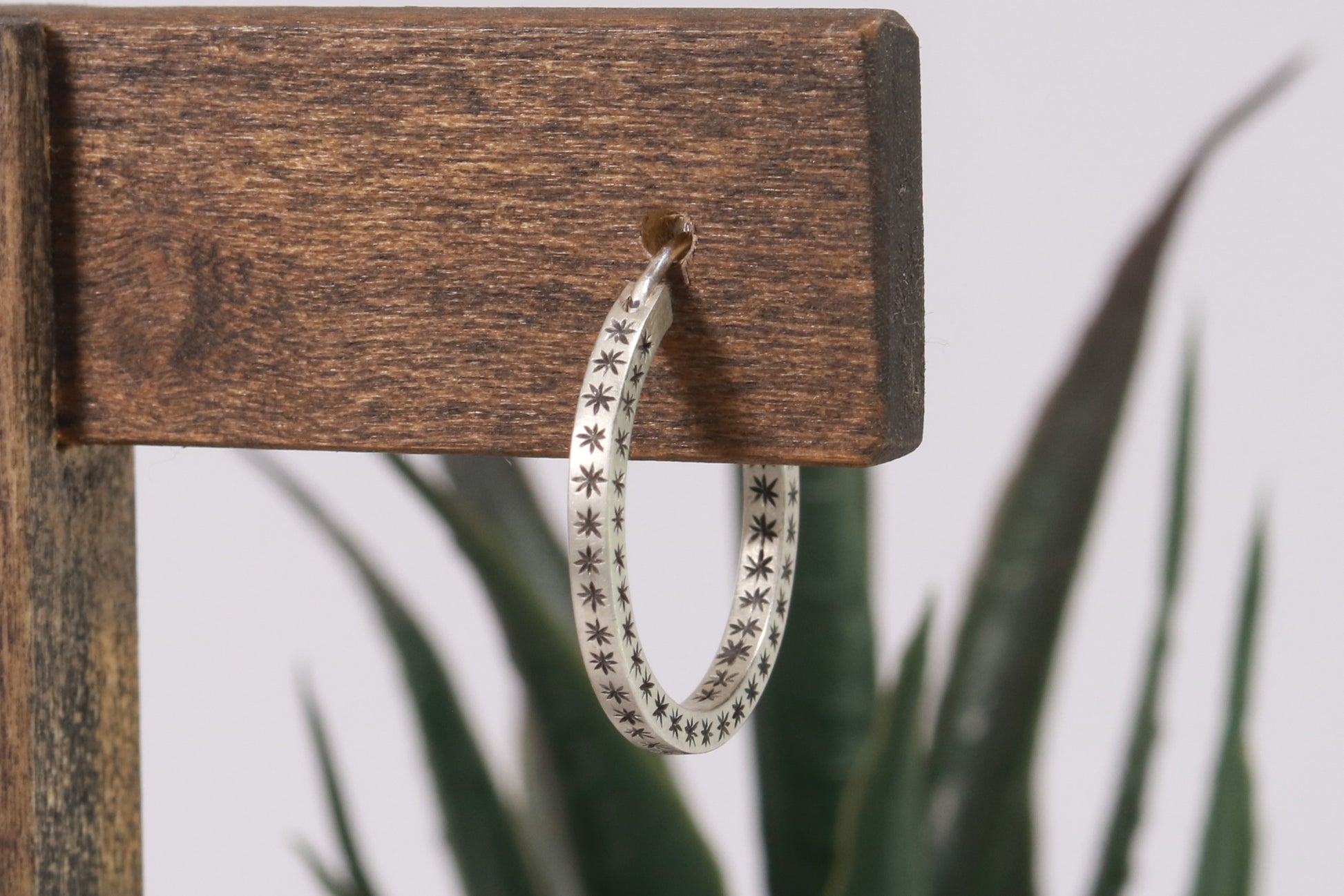 Closing hoops made from 2mm x 2mm square sterling silver, hand cut black stars on all sides.