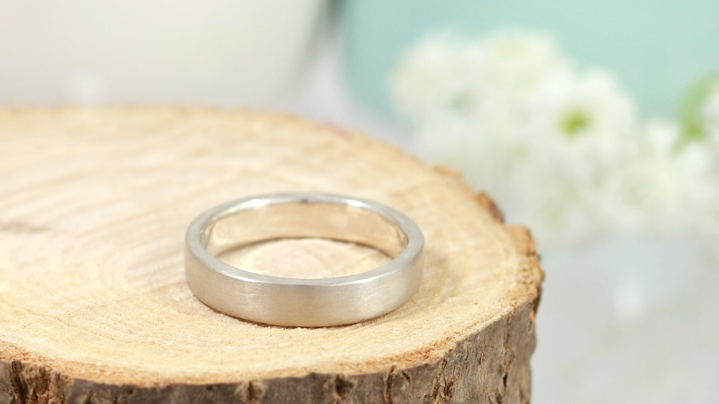 A sterling silver ring band with a matte finish outside & polished finish inside, 4mm wide, 1.7mm thick.