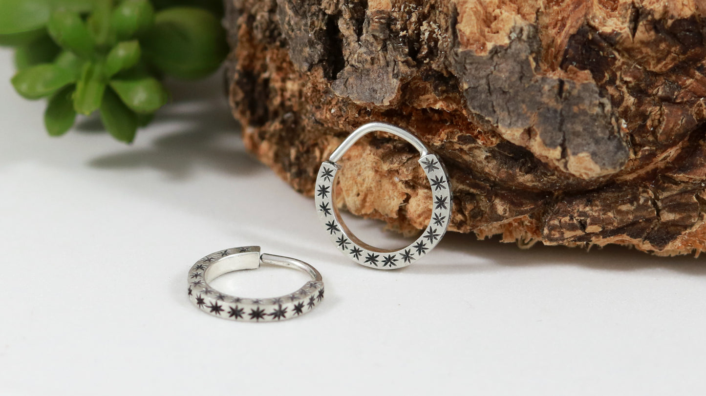 Hoops made from 1.5mm x 1.5mm square sterling silver, hand cut black stars on all outward facing sides.