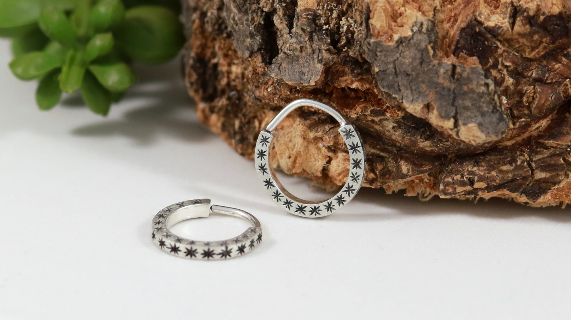 Hoops made from 1.5mm x 1.5mm square sterling silver, hand cut black stars on all outward facing sides.