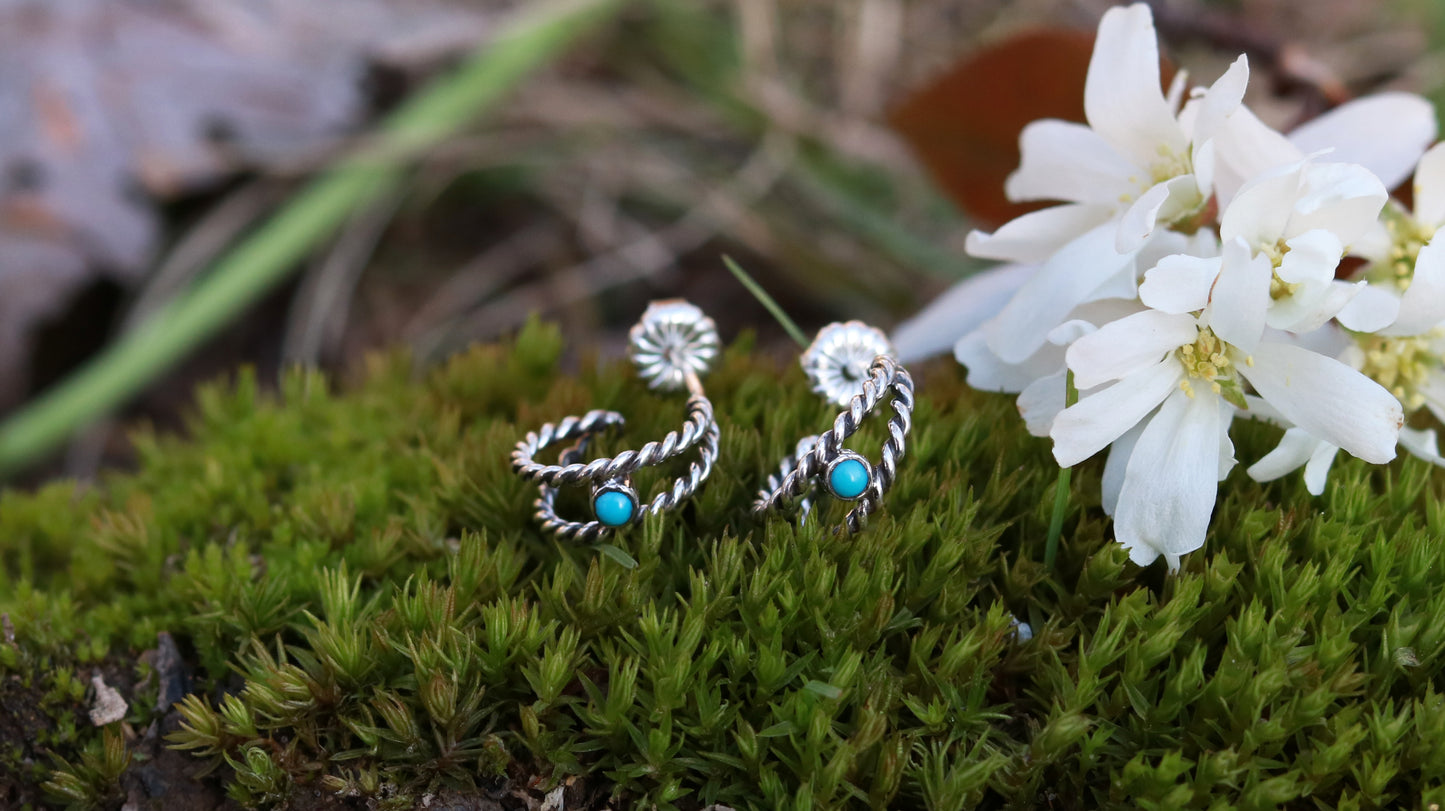Small hoop huggie earrings made from 2 twisted sterling silver hoops with a round natural gemstone.