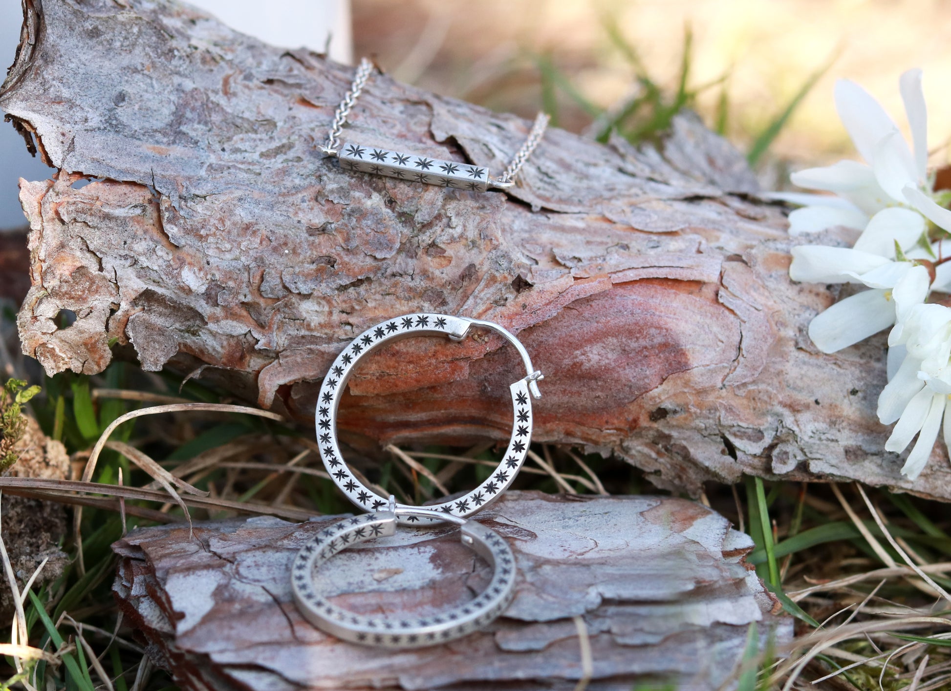 Closing hoops made from 2mm x 2mm square sterling silver, hand cut black stars on all sides.