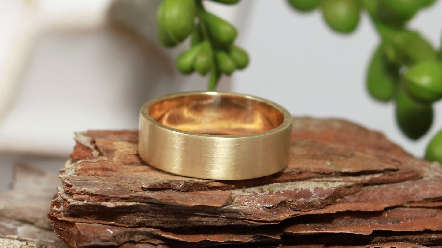 Solid 14k gold ring, 6mm wide, 1.75mm thick, matte finish outside, polished inside. Great wedding band.