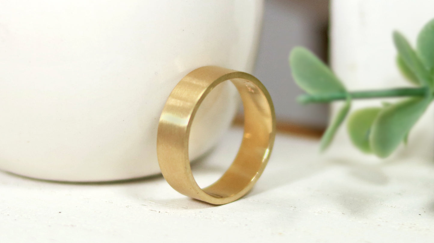 Solid 14k gold ring, 6mm wide, 1.75mm thick, matte finish outside, polished inside. Great wedding band.
