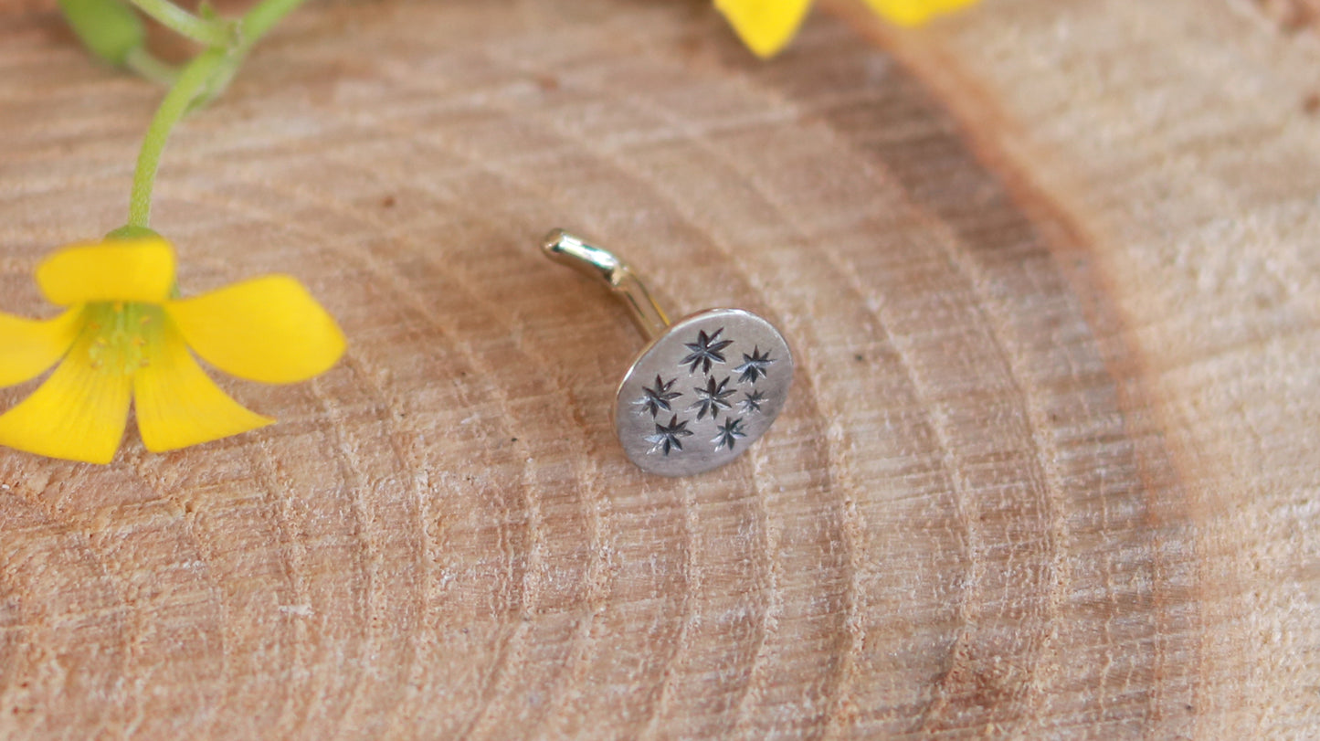 5mm, flat, solid 14k white gold disc nose stud with black hand carved stars.