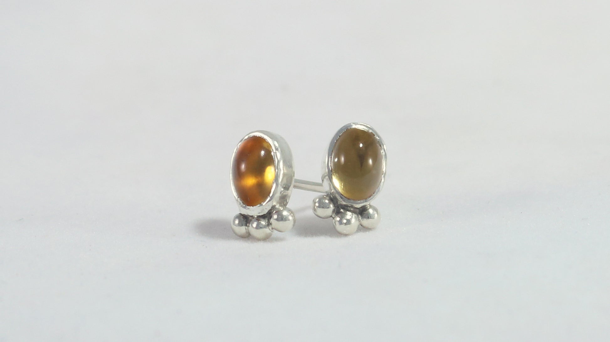 Vertical oval natural gemstone set in sterling silver bezel stud earrings with 3 silver bubble accent.