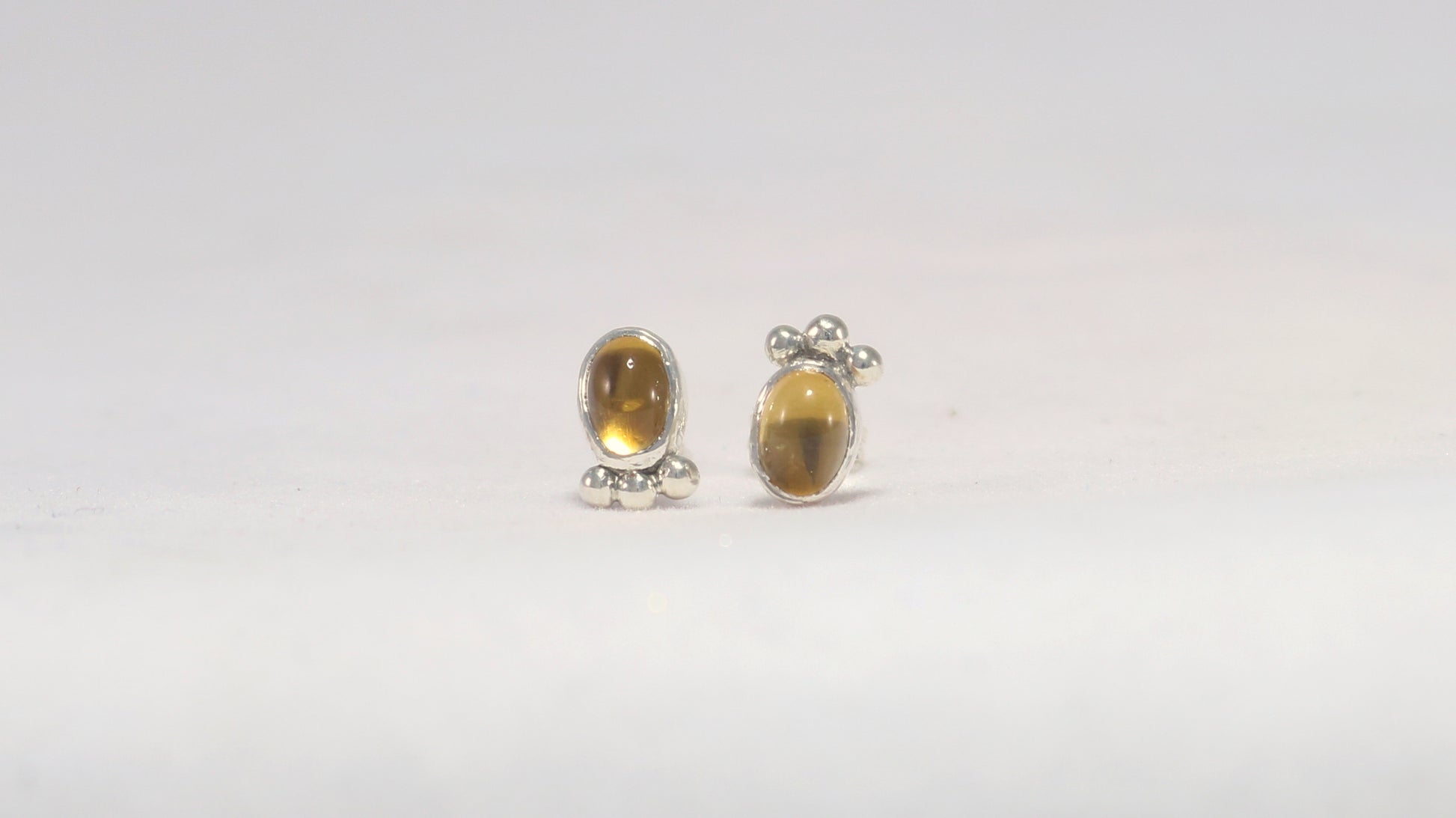 Vertical oval natural gemstone set in sterling silver bezel stud earrings with 3 silver bubble accent.