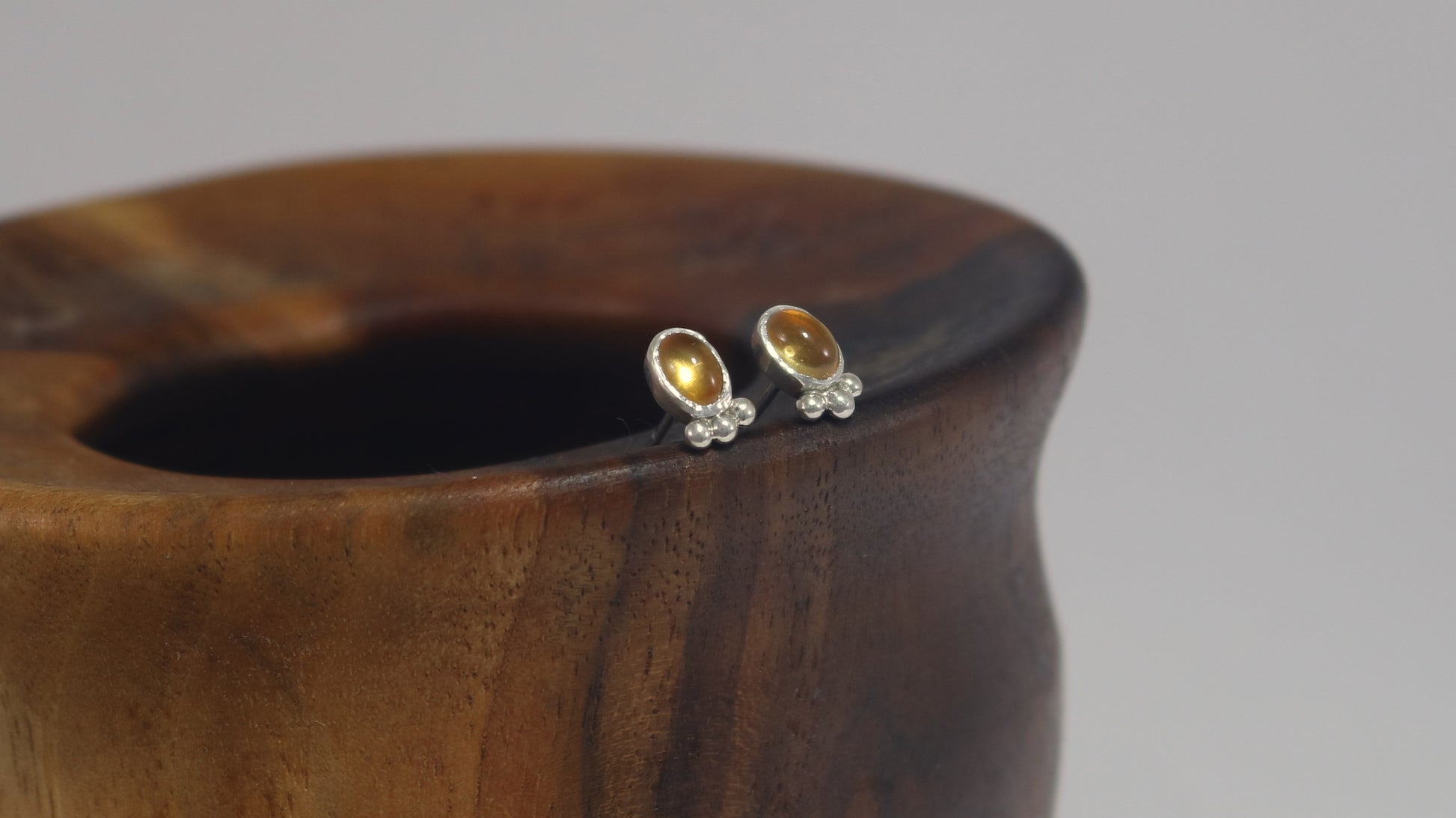Vertical oval natural gemstone set in sterling silver bezel stud earrings with 3 silver bubble accent.
