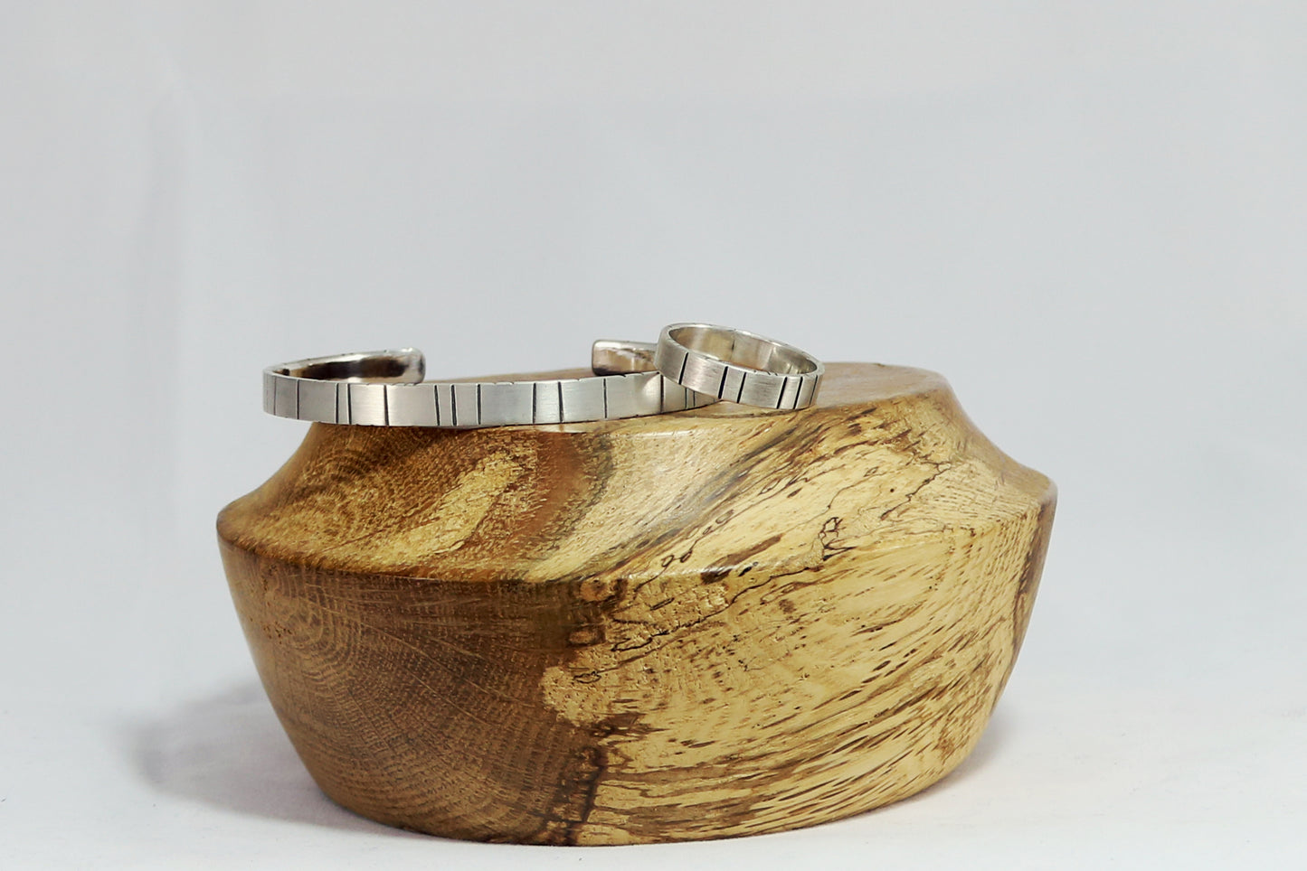 6mm sterling silver cuff with randomly spaced black lines.