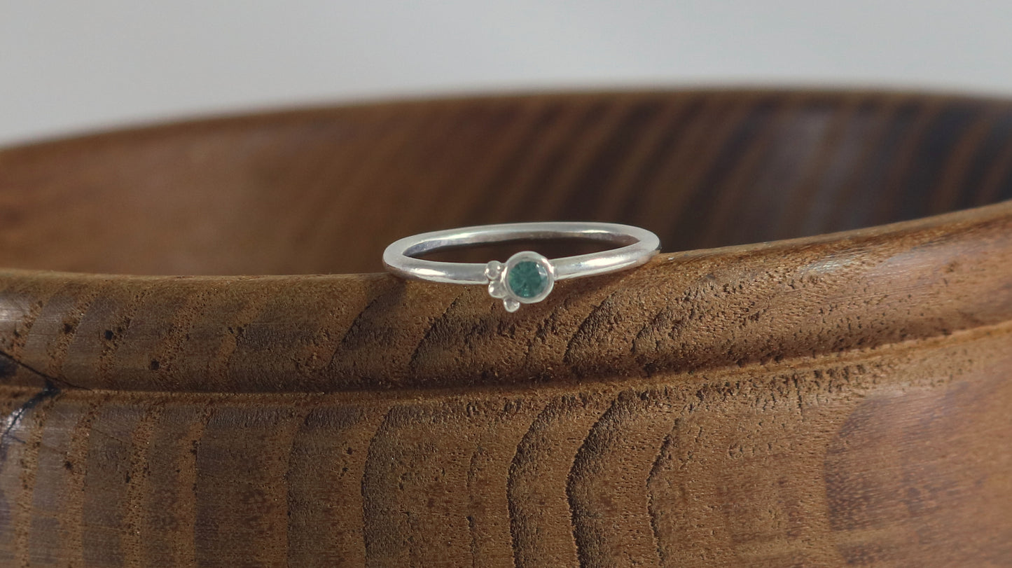 Natural gemstone set in sterling silver bezel, 3 silver bubble accents along bezel on sterling silver ring band.
