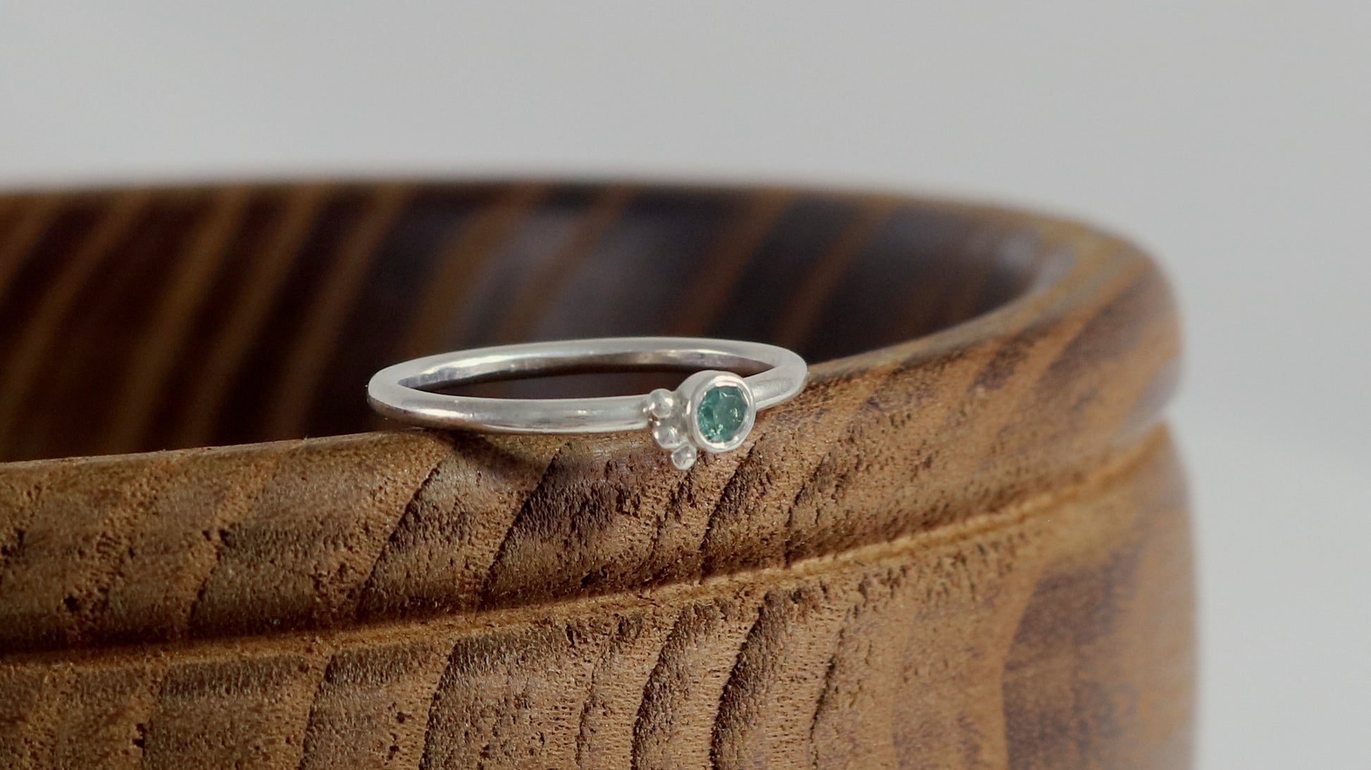 Natural gemstone set in sterling silver bezel, 3 silver bubble accents along bezel on sterling silver ring band.