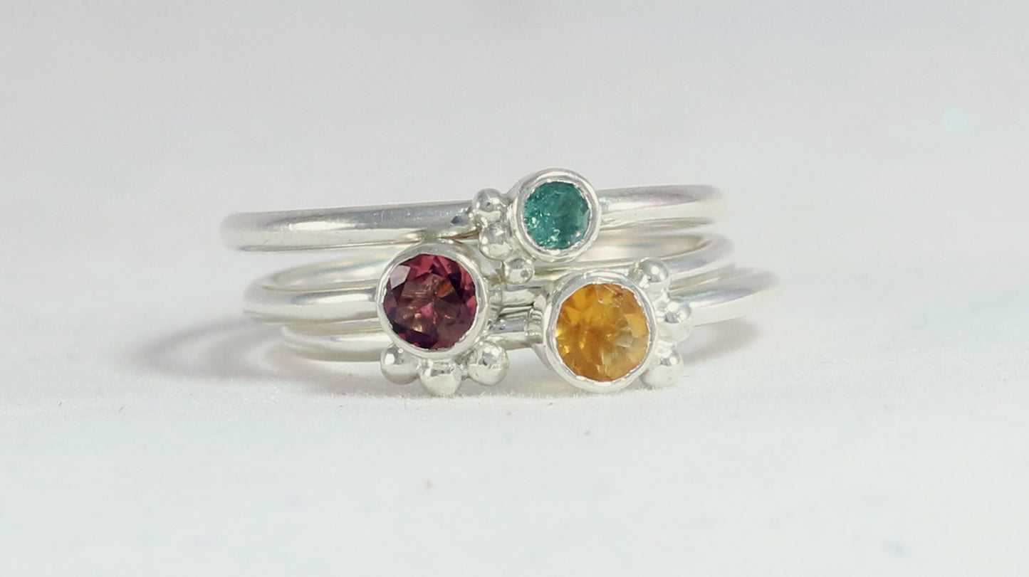 Natural gemstone set in sterling silver bezel, 3 silver bubble accents along bezel on sterling silver ring band.