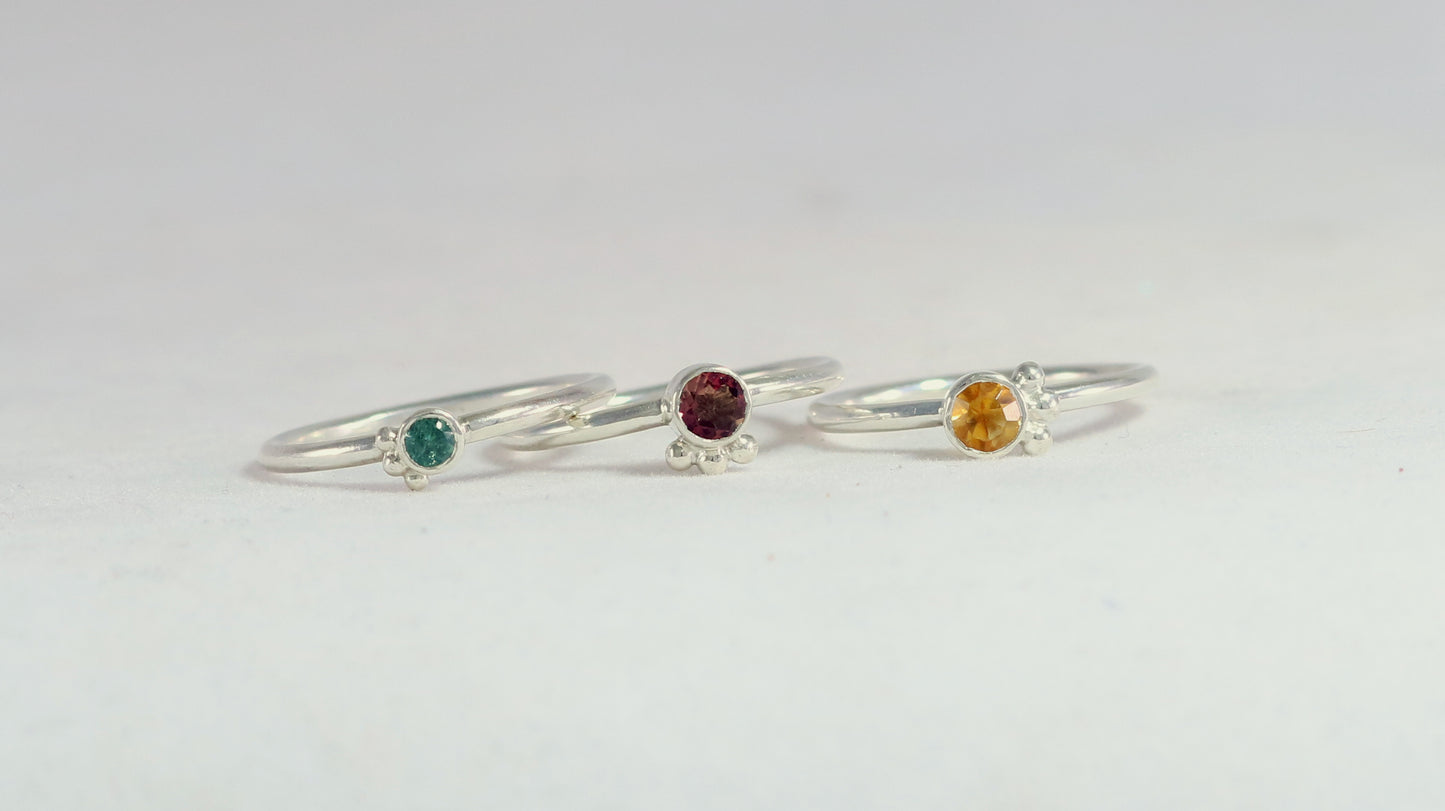 Natural gemstone set in sterling silver bezel, 3 silver bubble accents along bezel on sterling silver ring band.