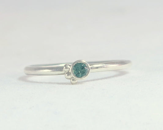 Natural gemstone set in sterling silver bezel, 3 silver bubble accents along bezel on sterling silver ring band.