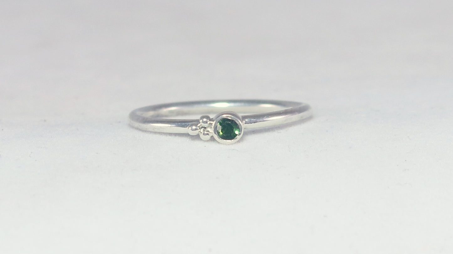 Natural gemstone set in sterling silver bezel on a sterling silver ring band with 3 silver bubbles in a pyramid.