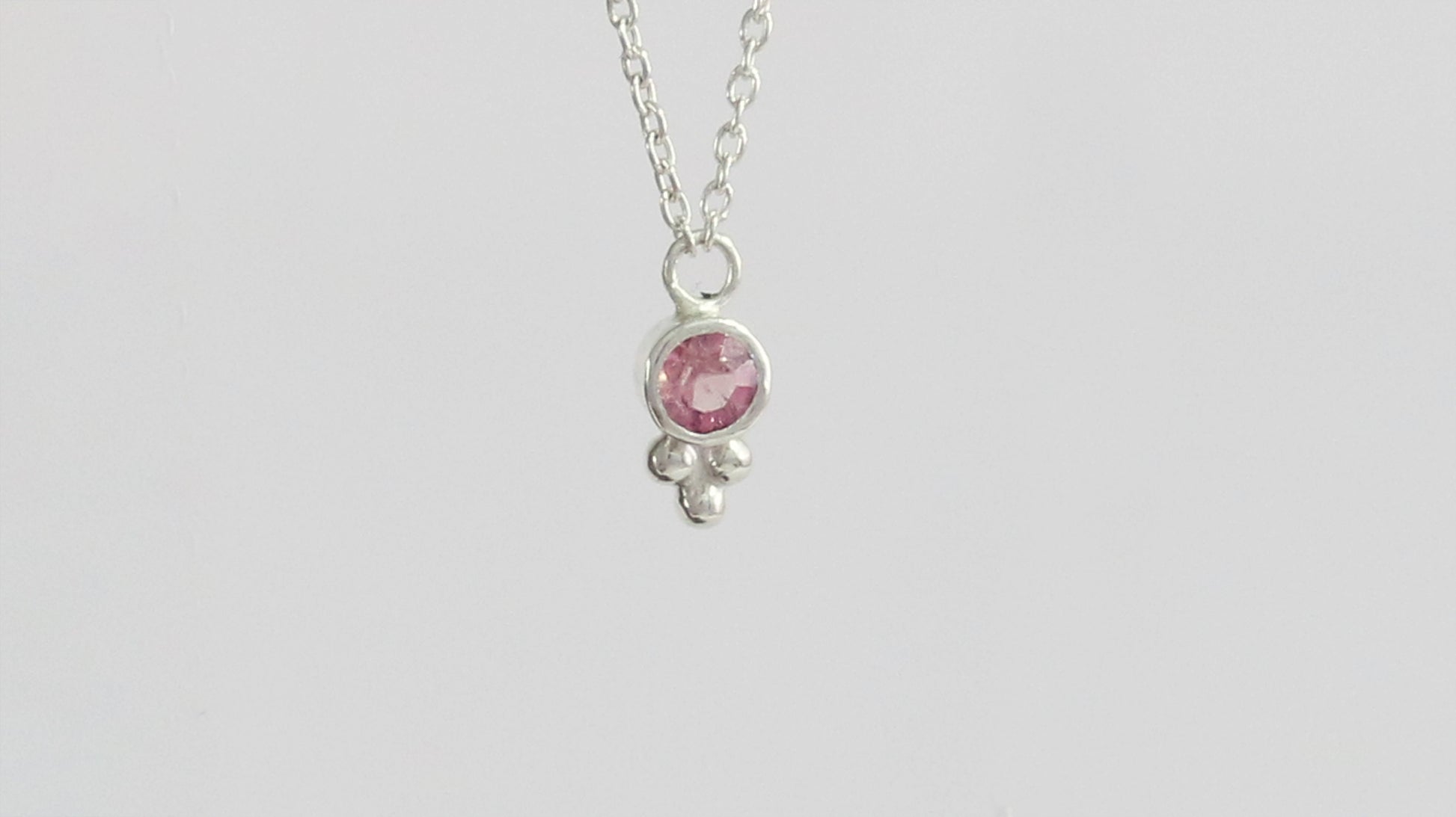 Natural gemstone set in sterling silver bezel, silver bubble pyramid accent on a sterling silver chain.