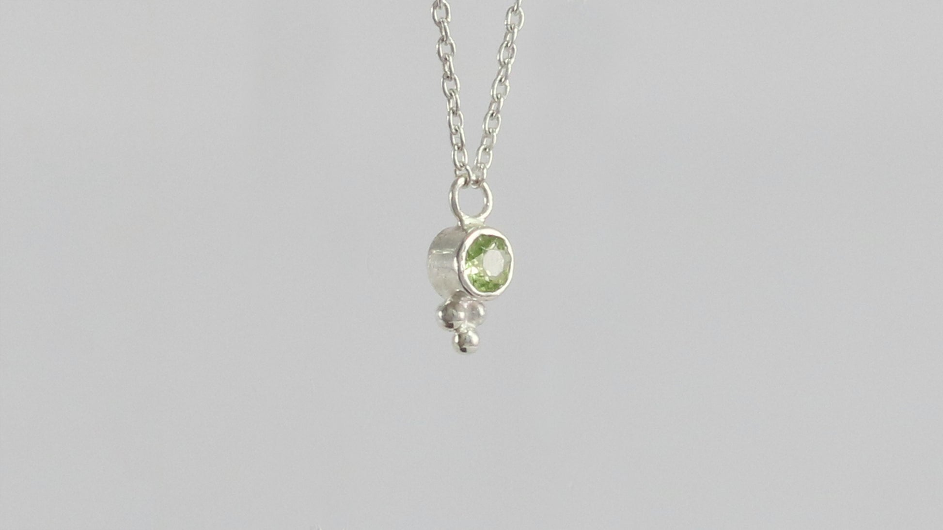 Natural gemstone set in sterling silver bezel, silver bubble pyramid accent on a sterling silver chain.