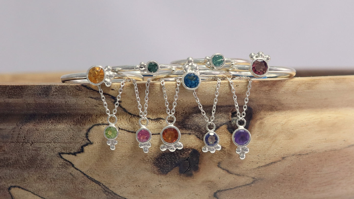 Natural gemstone set in sterling silver bezel with 3 silver bubble accents on a sterling silver chain.