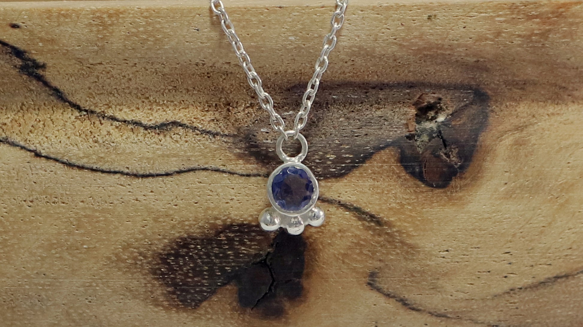 Natural gemstone set in sterling silver bezel with 3 silver bubble accents on a sterling silver chain.
