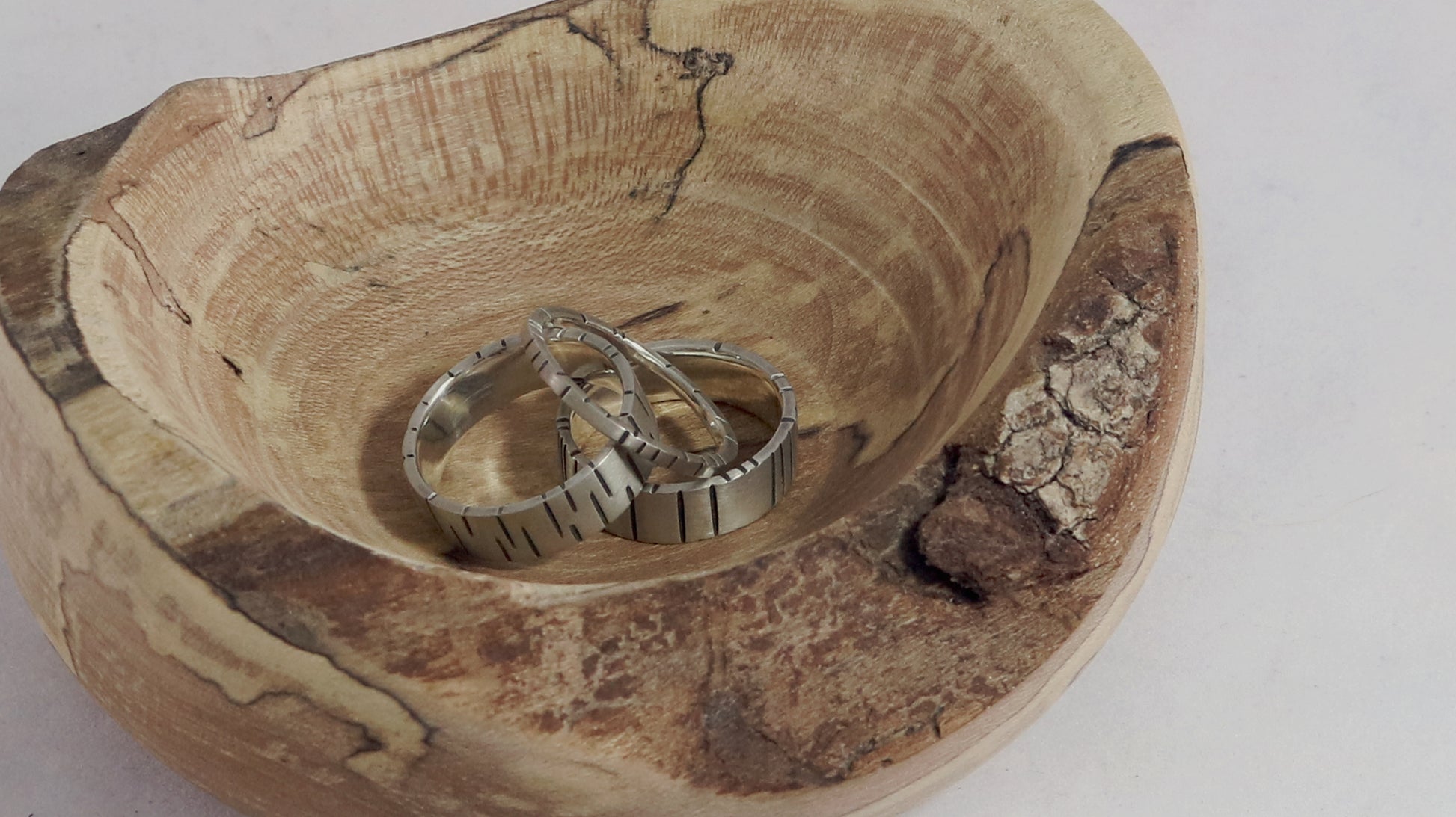 6mm sterling silver ring band with offset, randomly spaced, black lines.