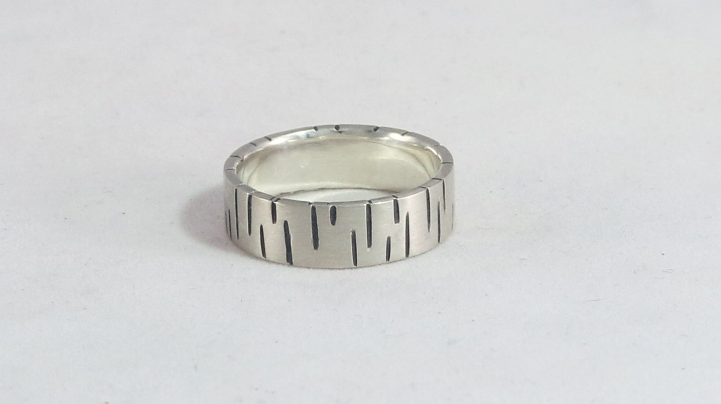 6mm sterling silver ring band with offset, randomly spaced, black lines.