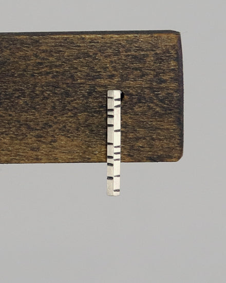 1.5mm thick solid sterling silver, rectangle bar studs with randomly spaced black lines.