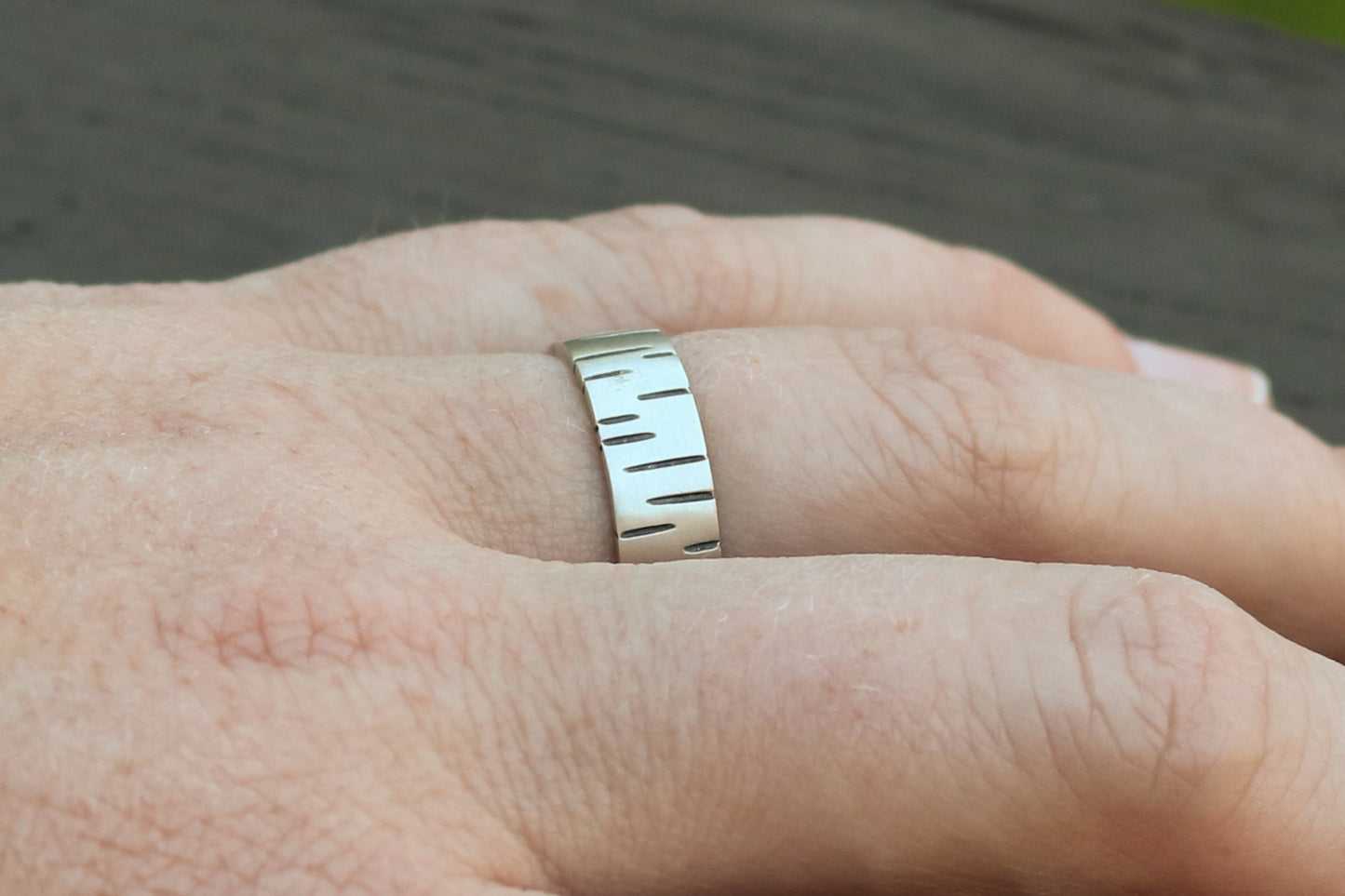 6mm sterling silver ring band with offset, randomly spaced, black lines.