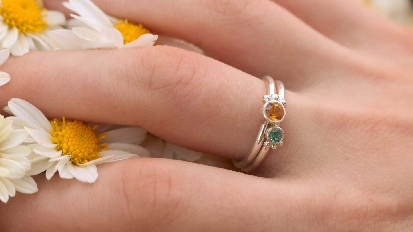 Natural gemstone set in sterling silver bezel, 3 silver bubble accents along bezel on sterling silver ring band.