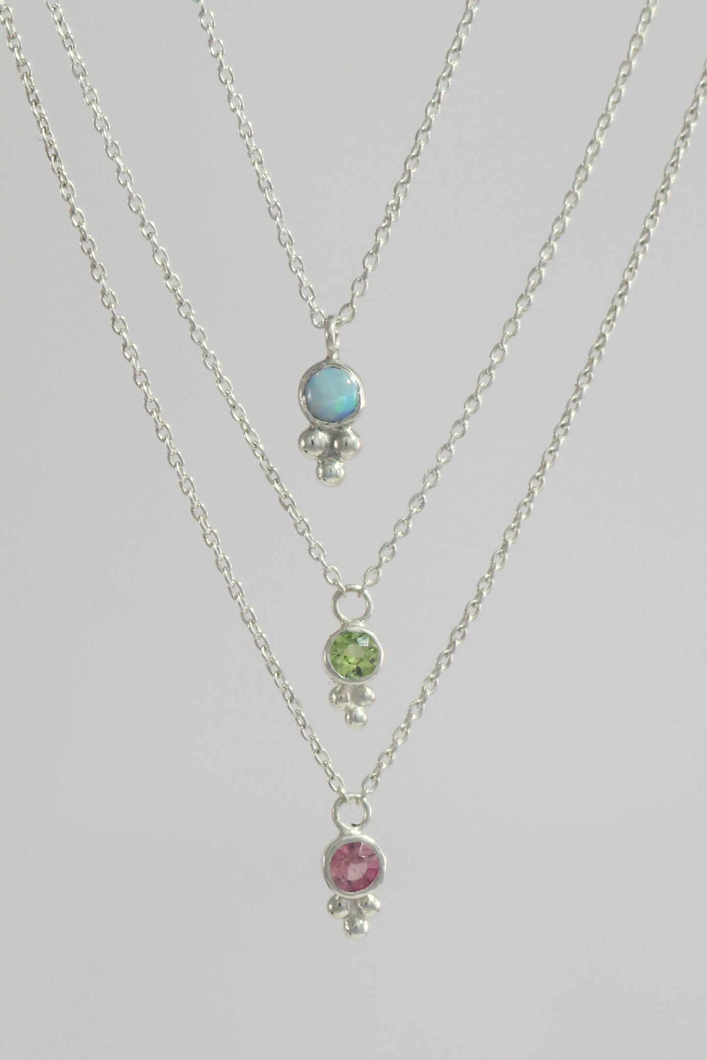 Natural gemstone set in sterling silver bezel, silver bubble pyramid accent on a sterling silver chain.