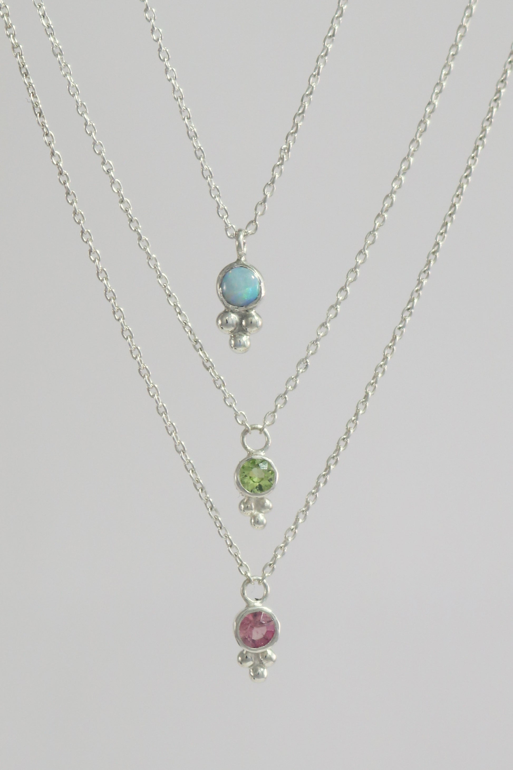 Natural gemstone set in sterling silver bezel, silver bubble pyramid accent on a sterling silver chain.