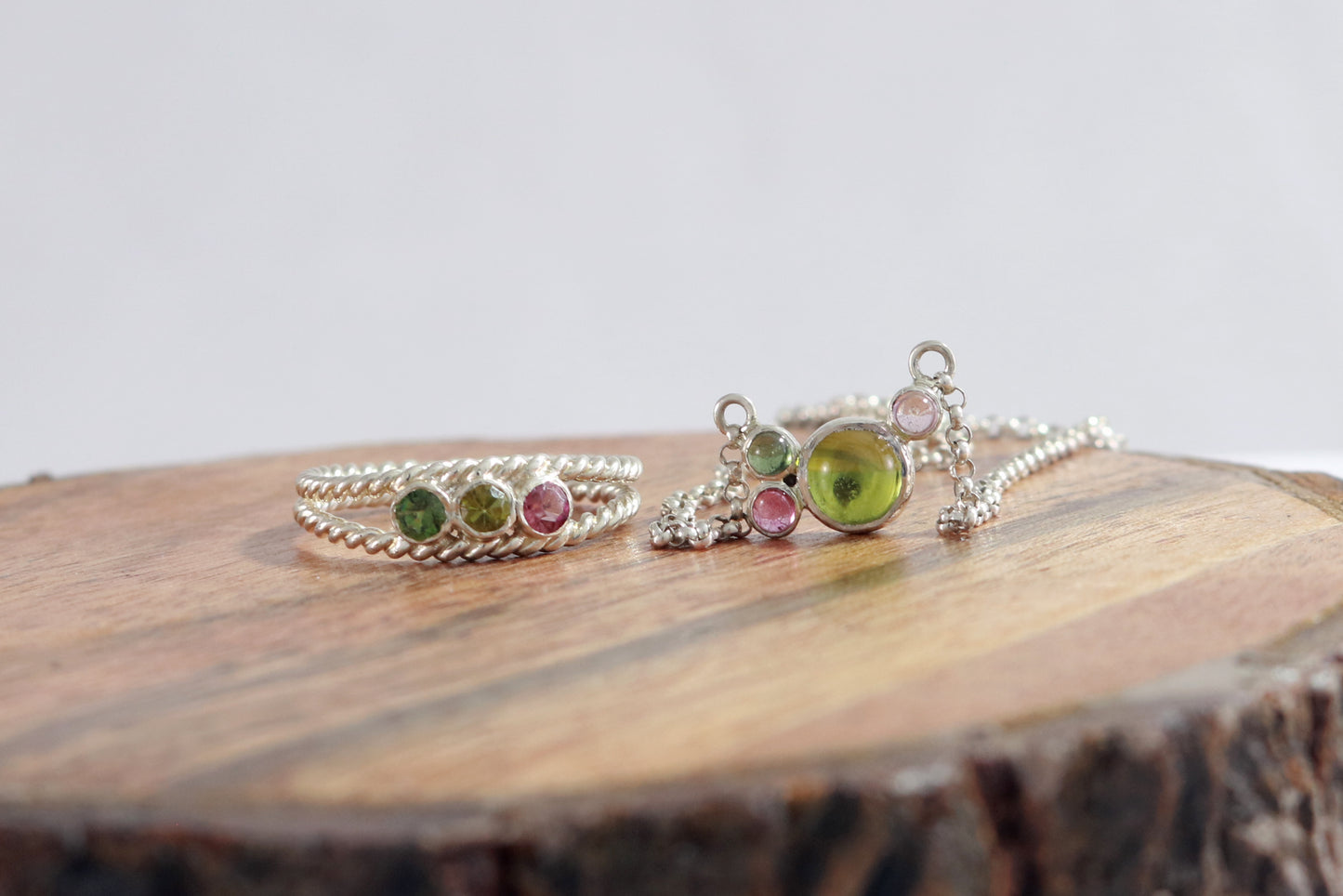 Round natural peridot & tourmaline gemstones set in sterling silver in a cluster on a sterling silver chain.
